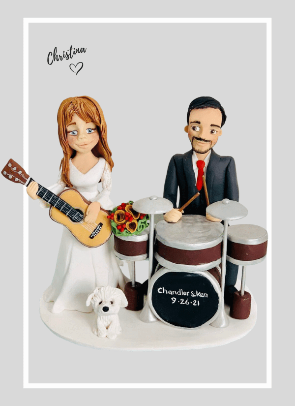 Fun custom made wedding cake topper - bride and groom in a band, drums and guitar