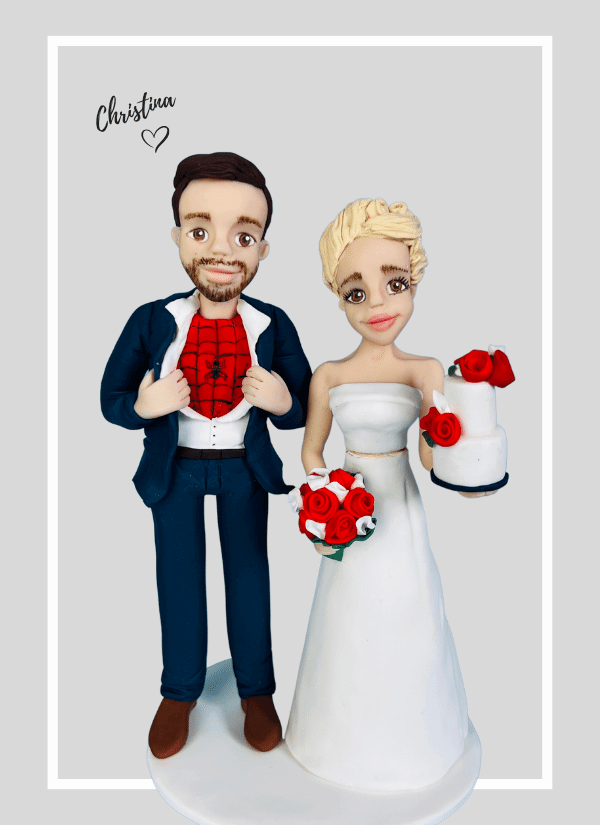 Red and white themed custom made wedding cake topper figures - spider man